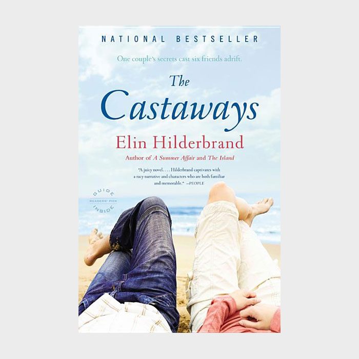 Two people relax on a beach, viewed from behind. Cover of 