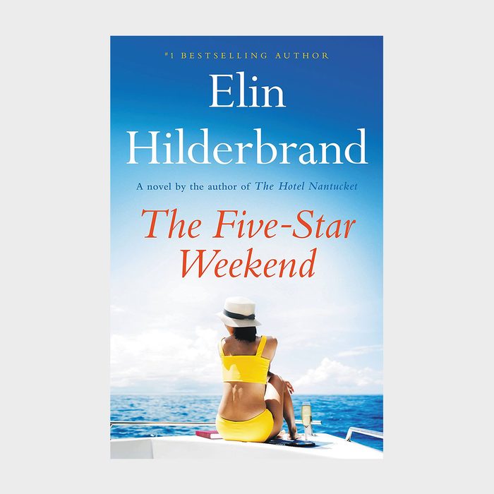 Woman in yellow swimsuit sits on boat, facing ocean. Sky is clear. Book title: 