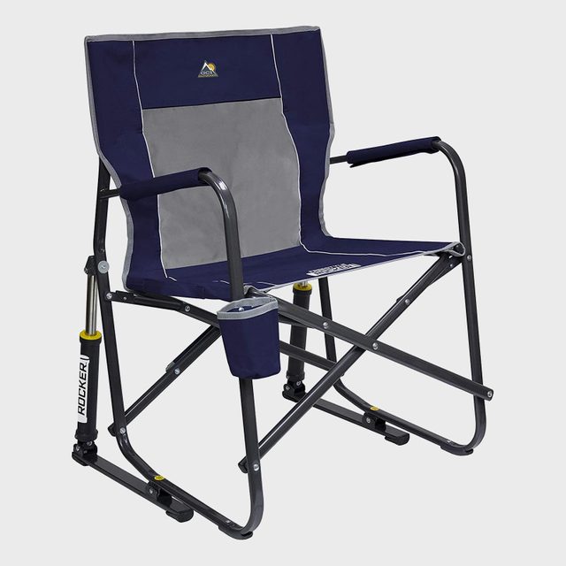 Chair stands with foldable blue fabric, metal armrests; rocking mechanism, cup holder attached. Set against a plain white background. Text reads 
