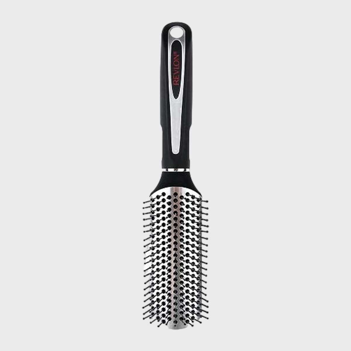 Hairbrush with black handle, metallic bristles exposed, designed for styling. "Revlon" text on the handle, set against a plain gray background.