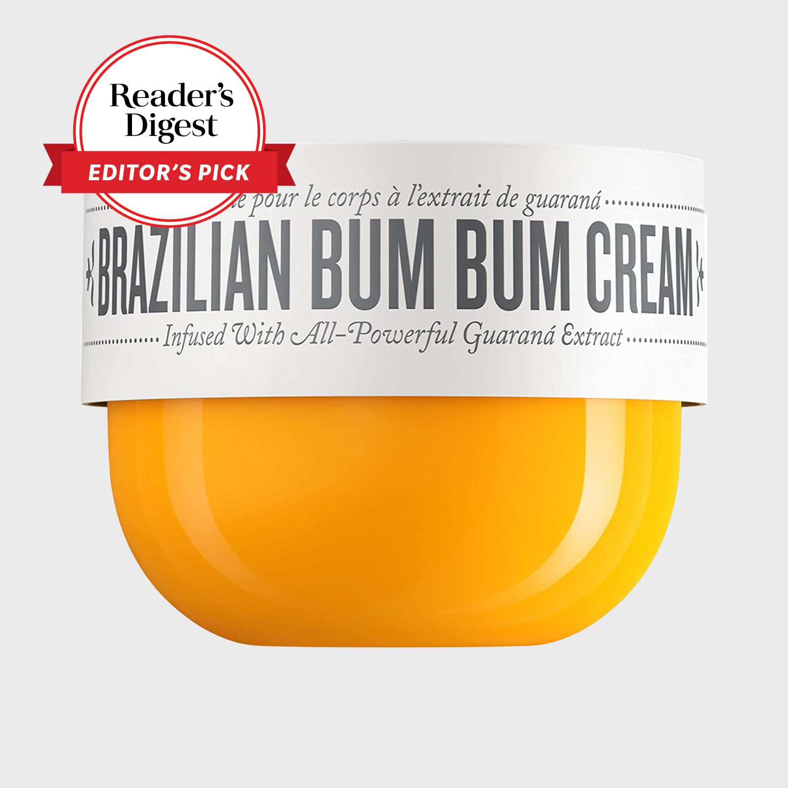 Orange jar showing "Brazilian Bum Bum Cream" label with guaranÃ¡ extract, set against a white background. "Readerâ€™s Digest Editor's Pick" badge is visible.