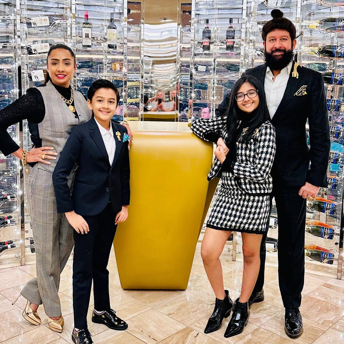 family of five posing for a picture on a cruise