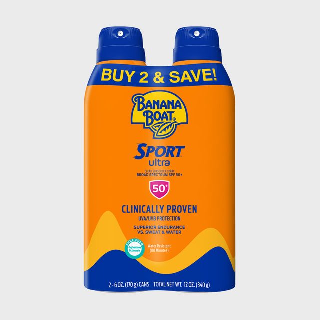 Two orange sunscreen spray bottles are packaged together, labeled 