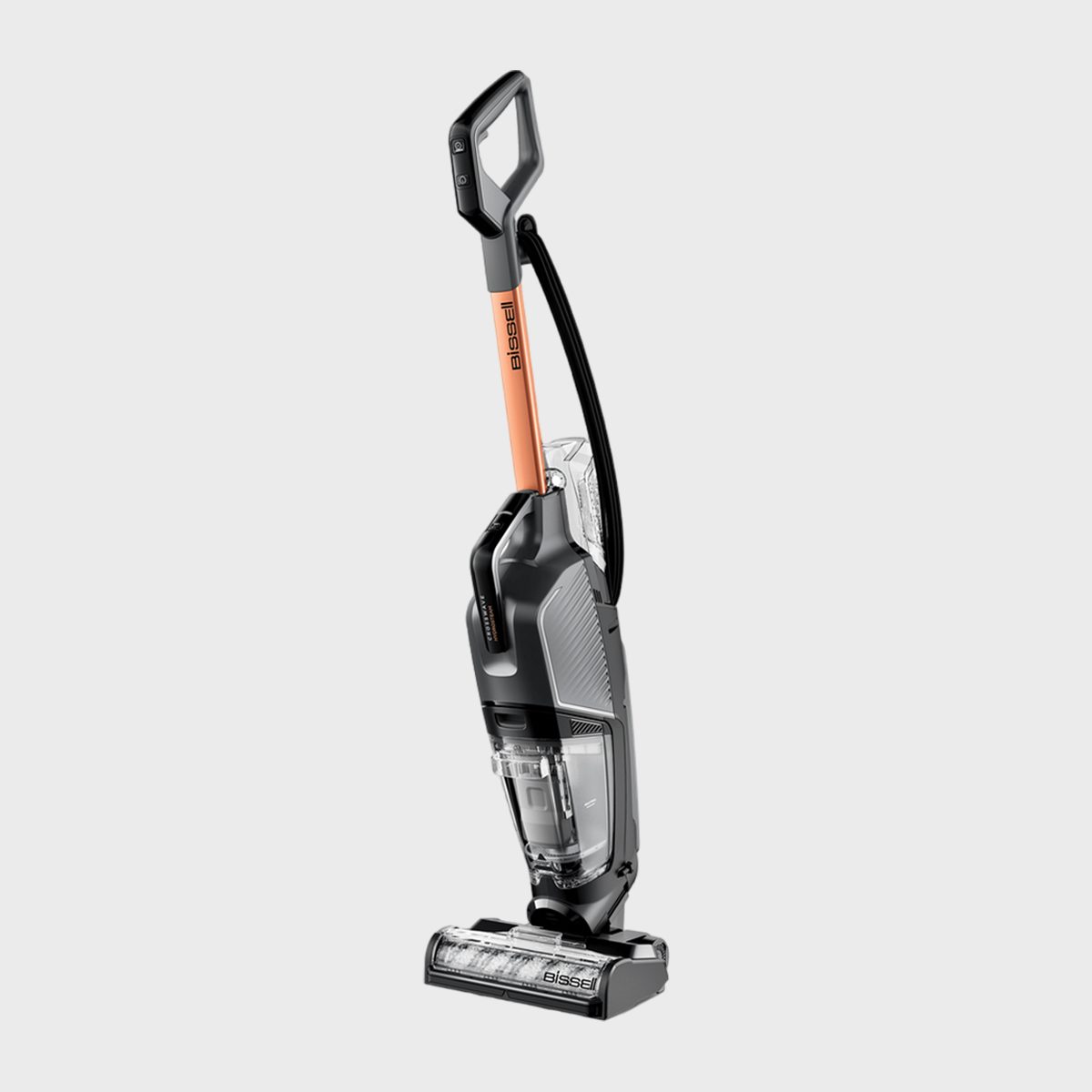 Vacuum cleaner stands upright, boasting a modern design with a copper handle; set against a plain white background. Brand name "Bissell" visible.