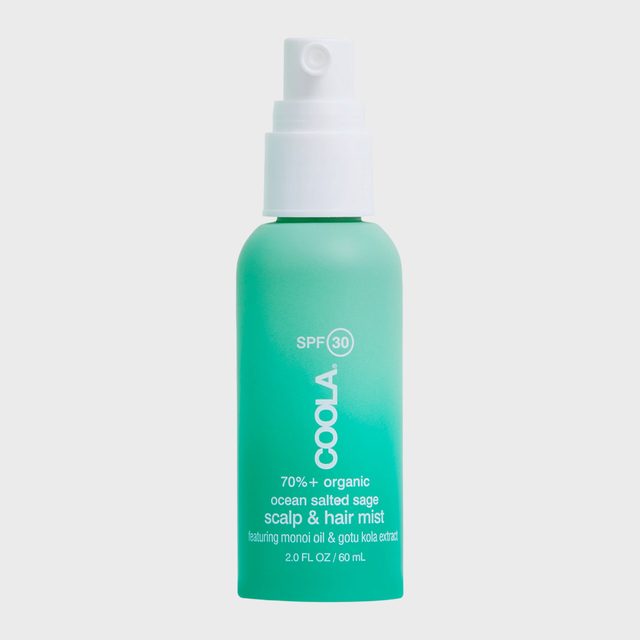 A turquoise spray bottle displays 