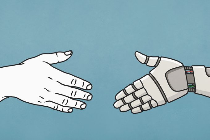 Human And Robot Shaking Hands