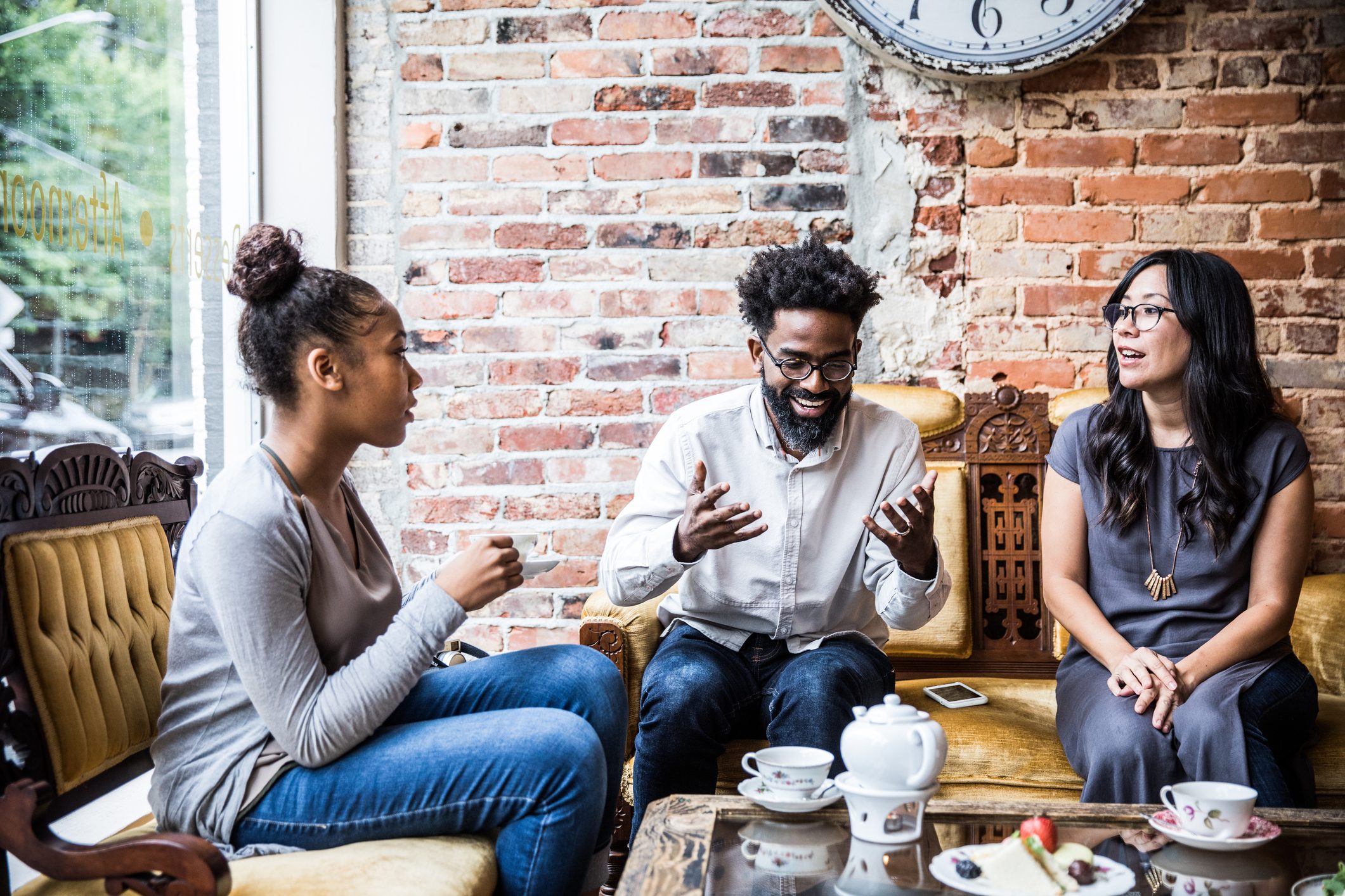 Group of friends enjoying tea at cool teashop