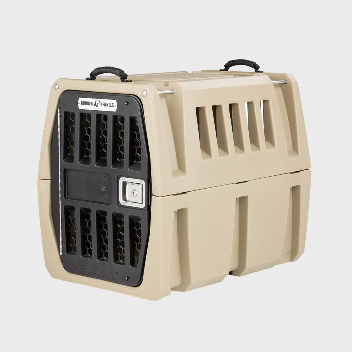 Dog crate with secure black door, two handles, and beige structure; designed for pet transport in a neutral, plain environment.