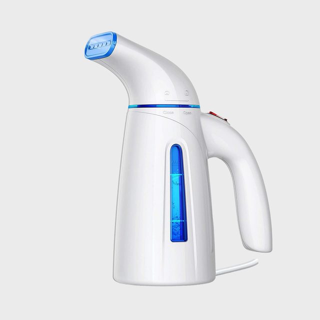A white handheld garment steamer sits idle with a blue water tank, against a plain gray background.