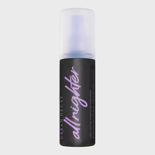 Bottle displaying makeup setting spray, standing upright against a plain background. Text reads: 