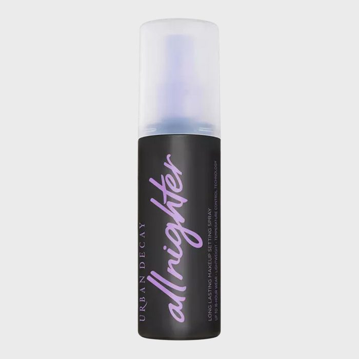 Bottle displaying makeup setting spray, standing upright against a plain background. Text reads: 
