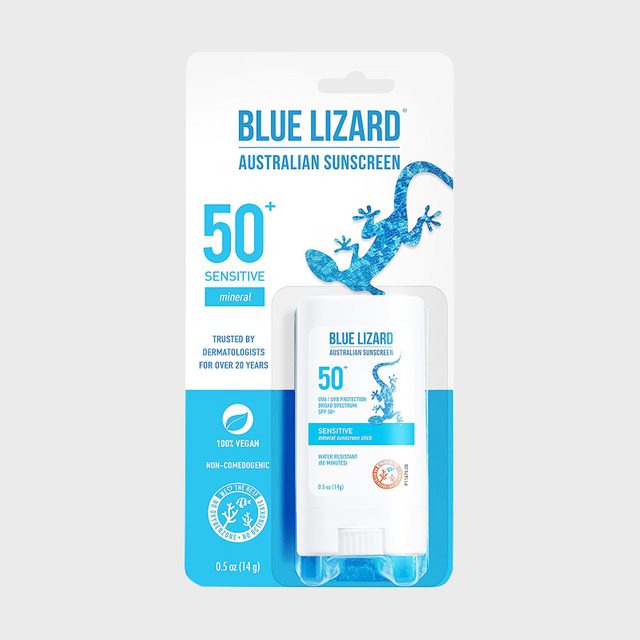 Sunscreen stick displayed in packaging with a blue lizard design, highlighting 
