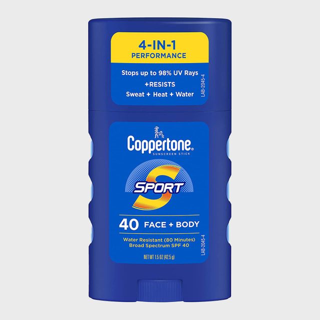 Blue sunscreen stick stands upright, labeled 