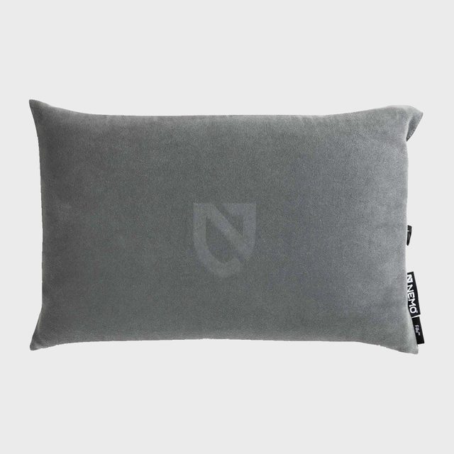 A rectangular gray pillow rests against a neutral background, featuring a subtle logo imprint and a tag labeled 