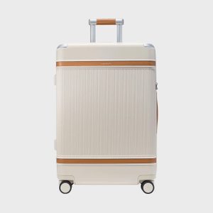 Beige suitcase stands upright with wheels, featuring brown accents and a telescoping handle; set against a plain, light background.