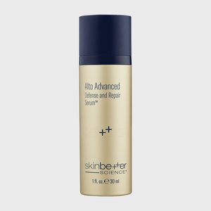 A gold cylindrical bottle displays 