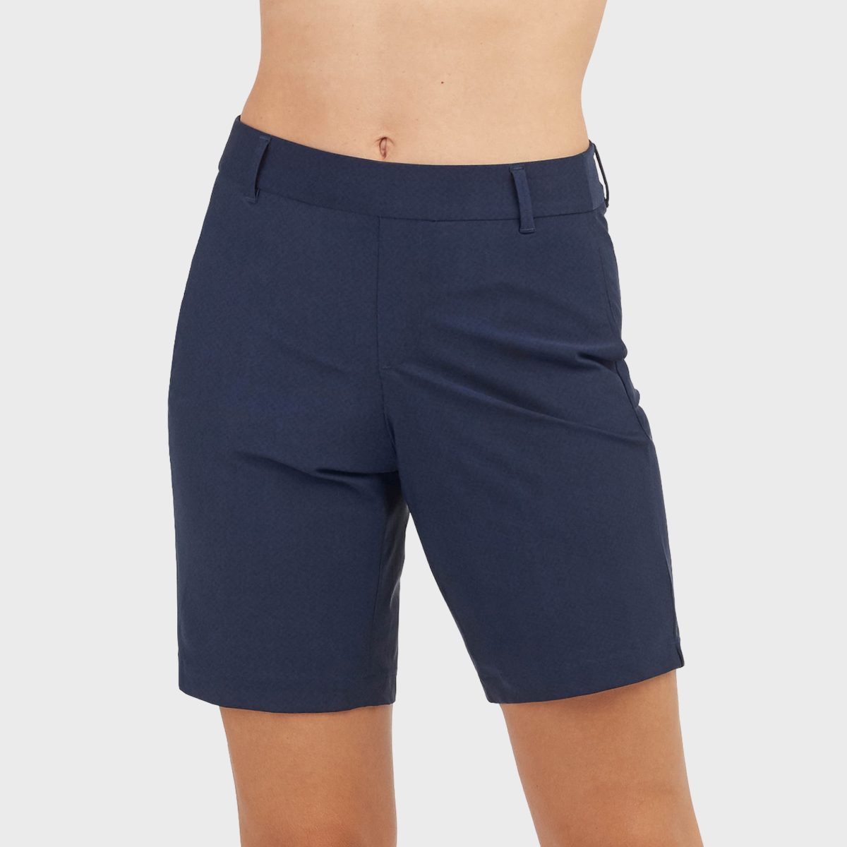 Navy blue shorts being worn, set against a plain white background.
