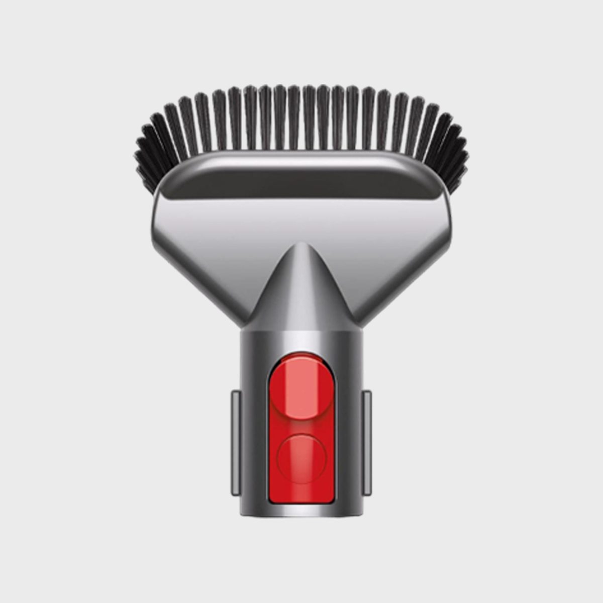Vacuum brush tool with stiff bristles, metallic finish, and red button, set against a plain white background.