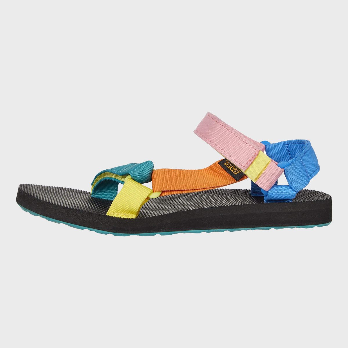 Multicolored sandal with adjustable straps resting on a flat, textured sole, set against a plain, white background.