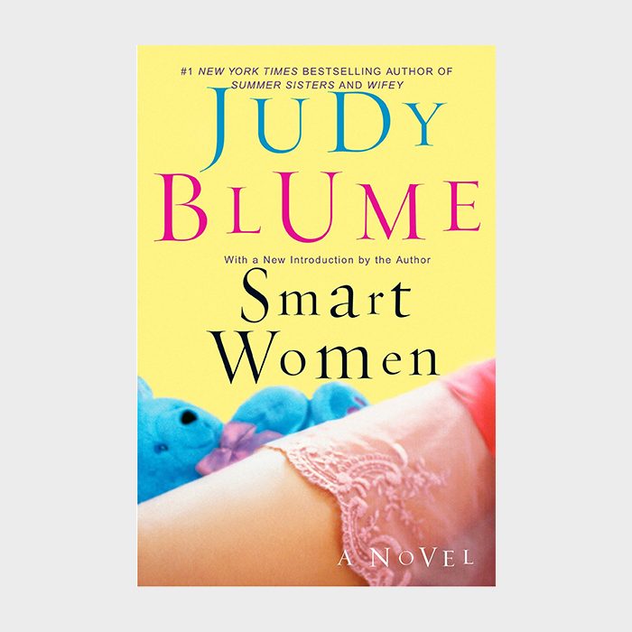 Book cover features colorful text on yellow background, with lace fabric draped over an arm; plush toys in background. Title: "Smart Women" by Judy Blume.