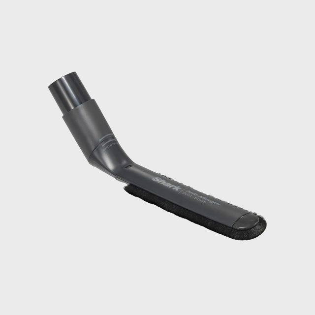 Vacuum attachment with a brush head, angled design; text reads 