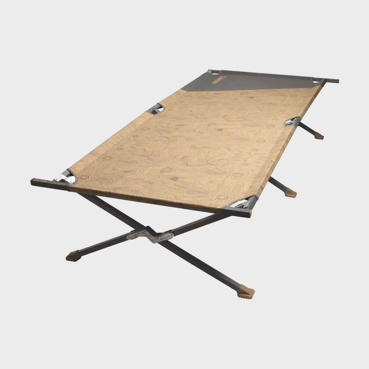 A foldable camping cot rests on crossbar legs with a tan, textured fabric surface against a plain background.