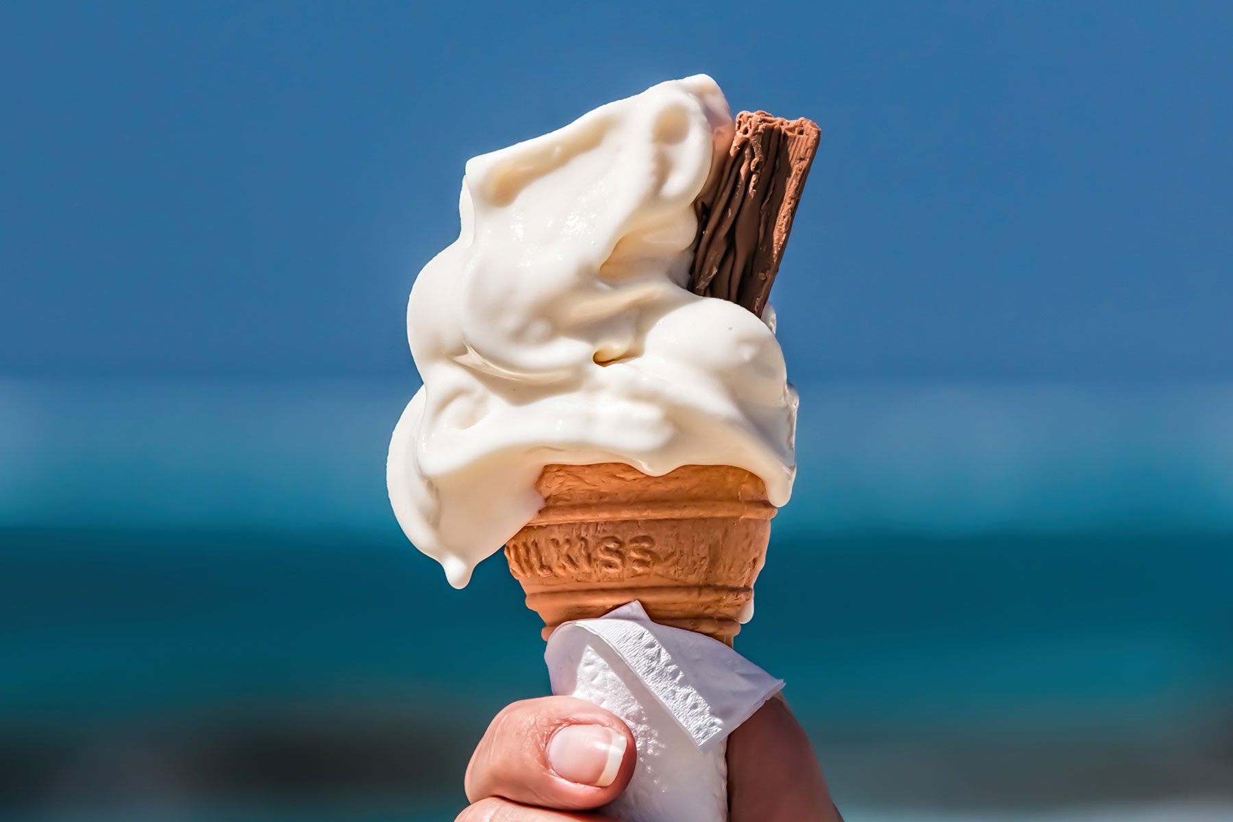 woman holding ice cream who begin melting