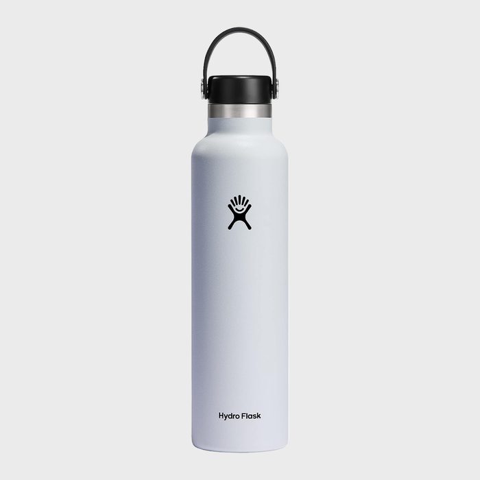 A white insulated water bottle stands upright, featuring a black cap with a handle, displayed on a plain white background. Text: 
