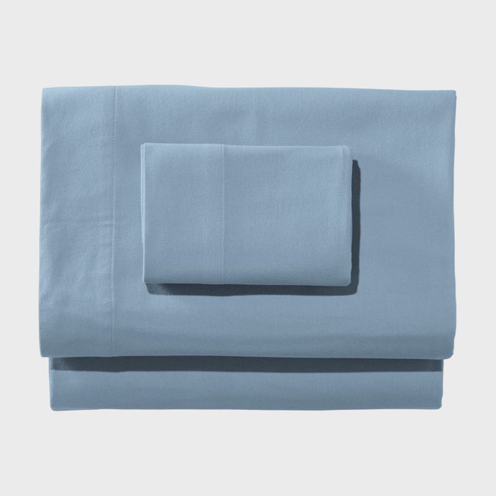 Blue sheets folded neatly, stacked in a simple arrangement, against a plain white background.