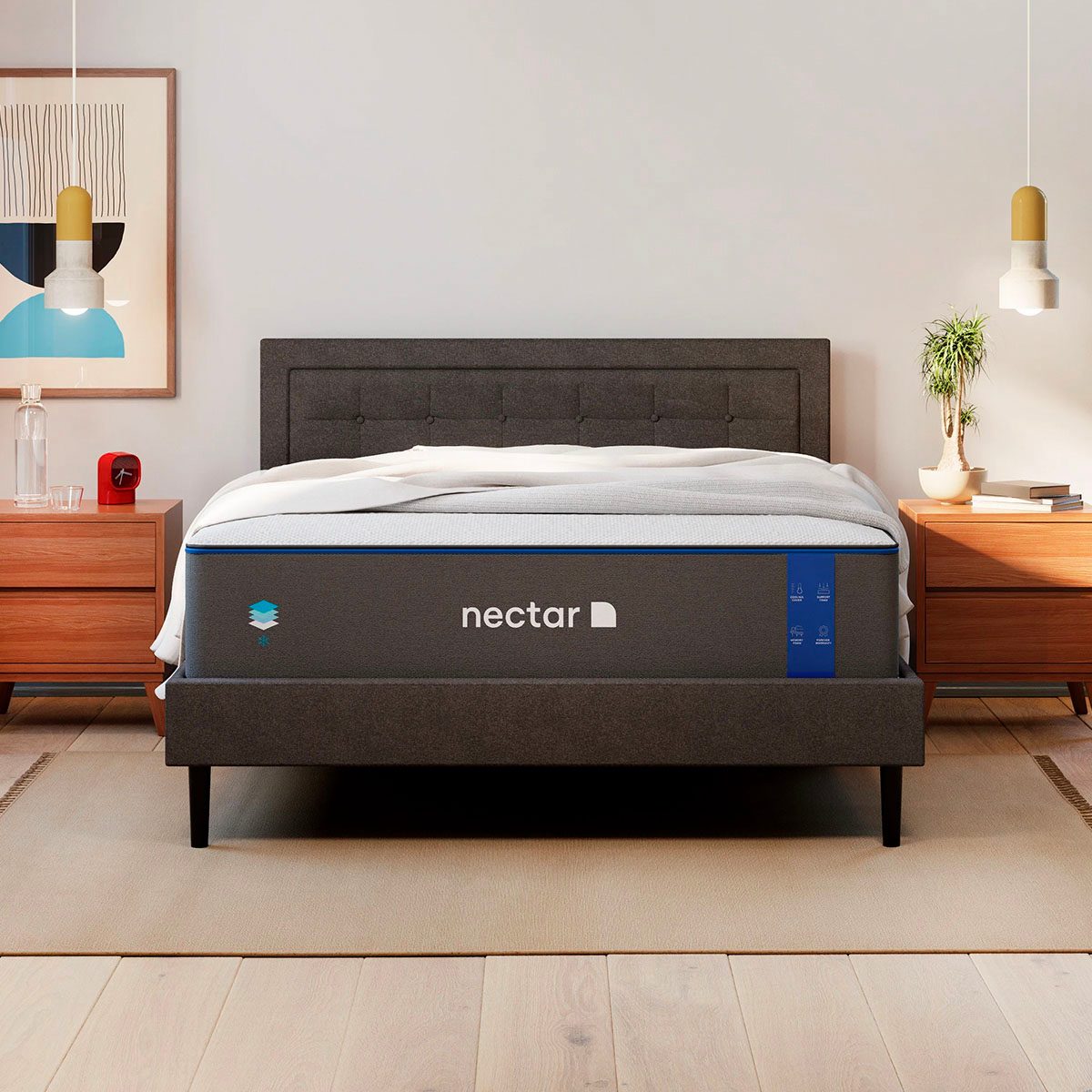 A bed stands between wooden nightstands, featuring a sleek dark frame and "nectar" branded mattress, in a modern, minimalist bedroom setting.