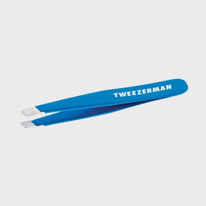Blue tweezers lie against a plain background, displaying the 