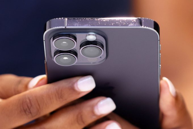 An attendee holds a new Apple iPhone 14 Pro during an Apple special event on September 07, 2022 in Cupertino, California