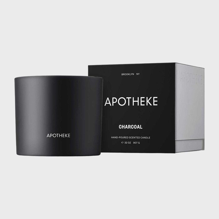 Black candle sits beside its matching box, labeled 