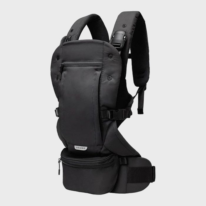 Black ergonomic baby carrier, positioned upright, with multiple straps and zippers, set against a plain gray background.