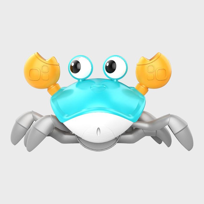 Colorful robotic crab with big eyes and bright pincers, posed against a plain white background.