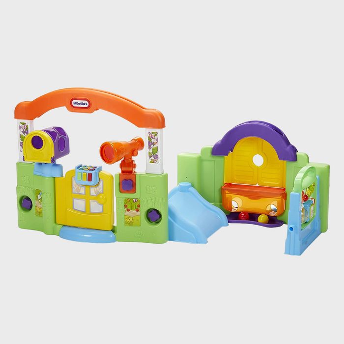 Playset features colorful slides, doors, and periscopes; designed for children's entertainment in a playful, vibrant setting. Text reads 