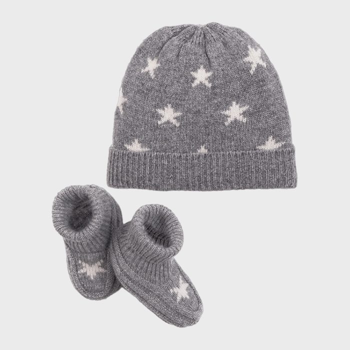 Gray knit hat and booties feature white star patterns, placed on a plain white background.
