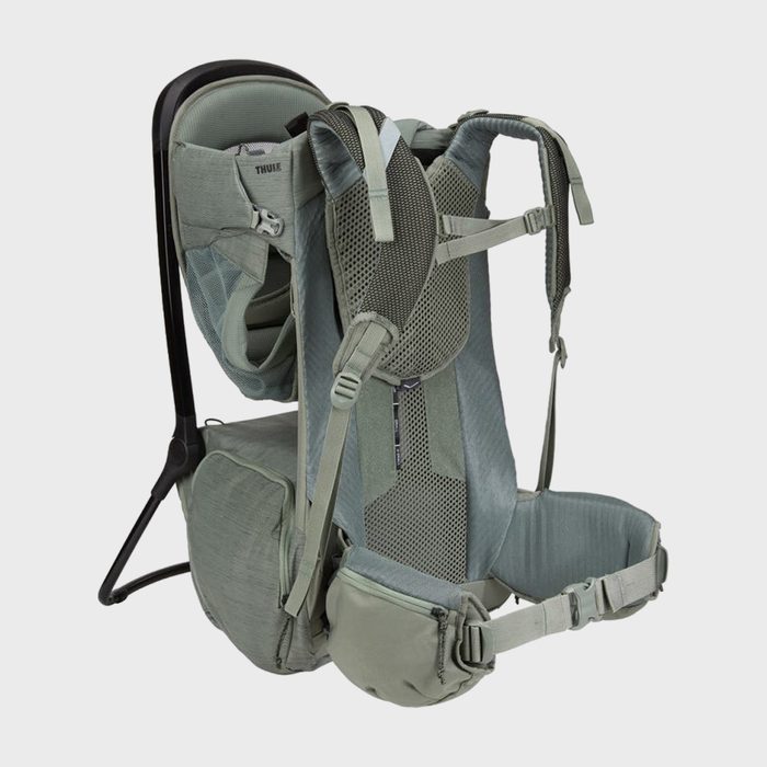Backpack stands with support legs extended, showcasing mesh straps and cushioned compartments, set against a plain gray background.