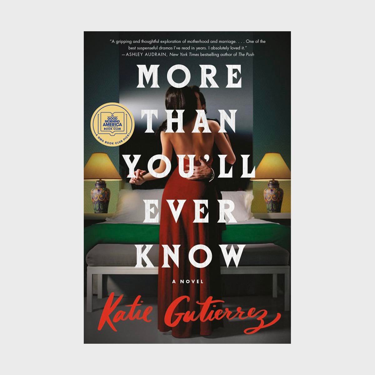 A couple embraces intimately in a dimly lit bedroom; text reads "More Than You'll Ever Know" by Katie Gutierrez.