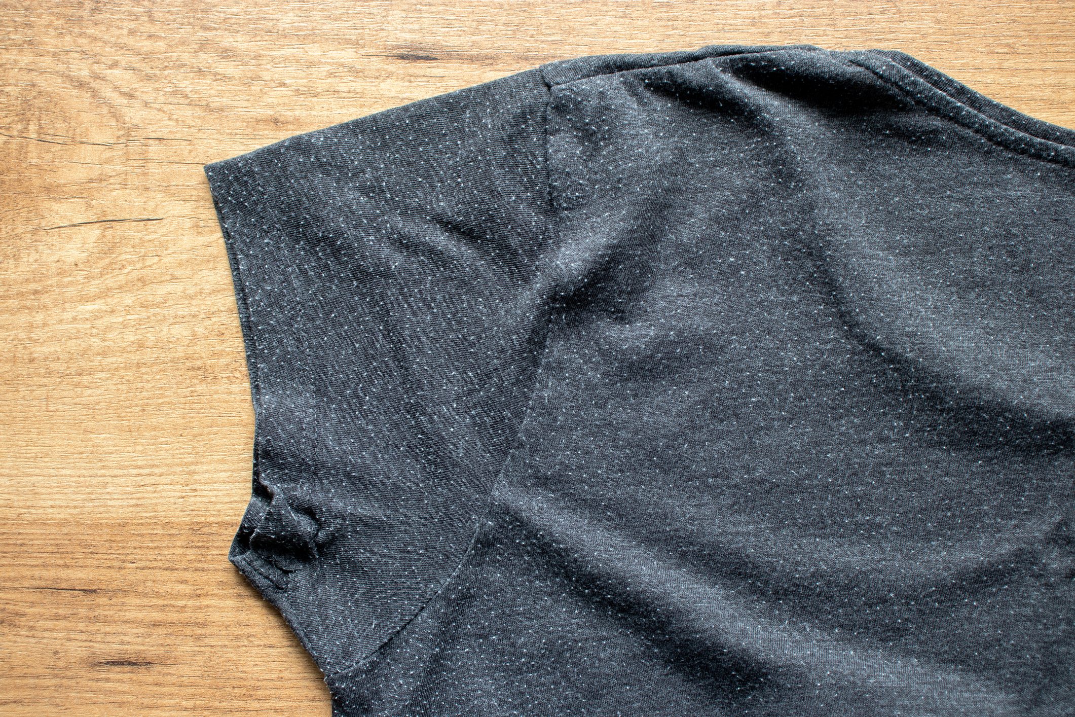 Pills on the gray tee-shirt cotton knit fabric