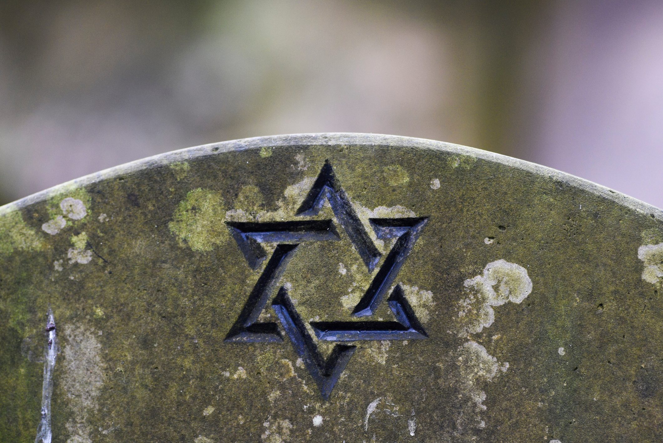 Star of David on a tombstone in a Jewish cemetery.