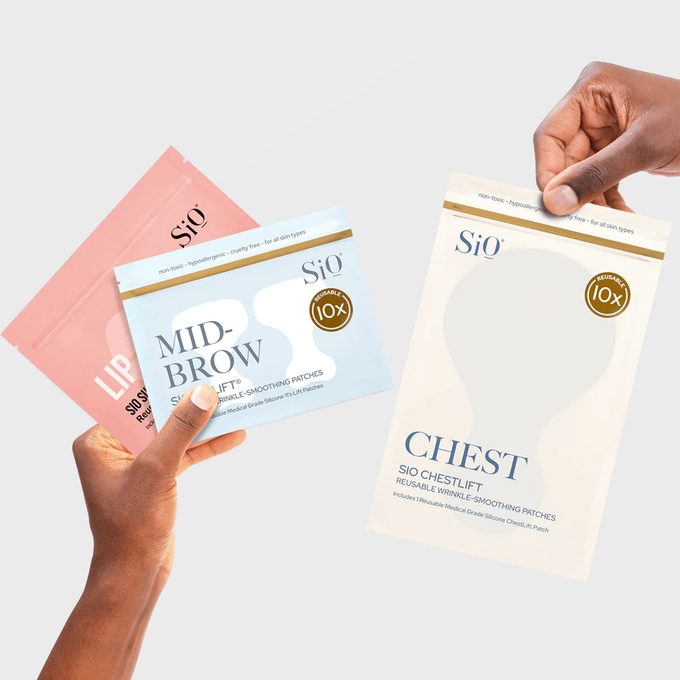 Hands hold three skincare patch packages; they are labeled 