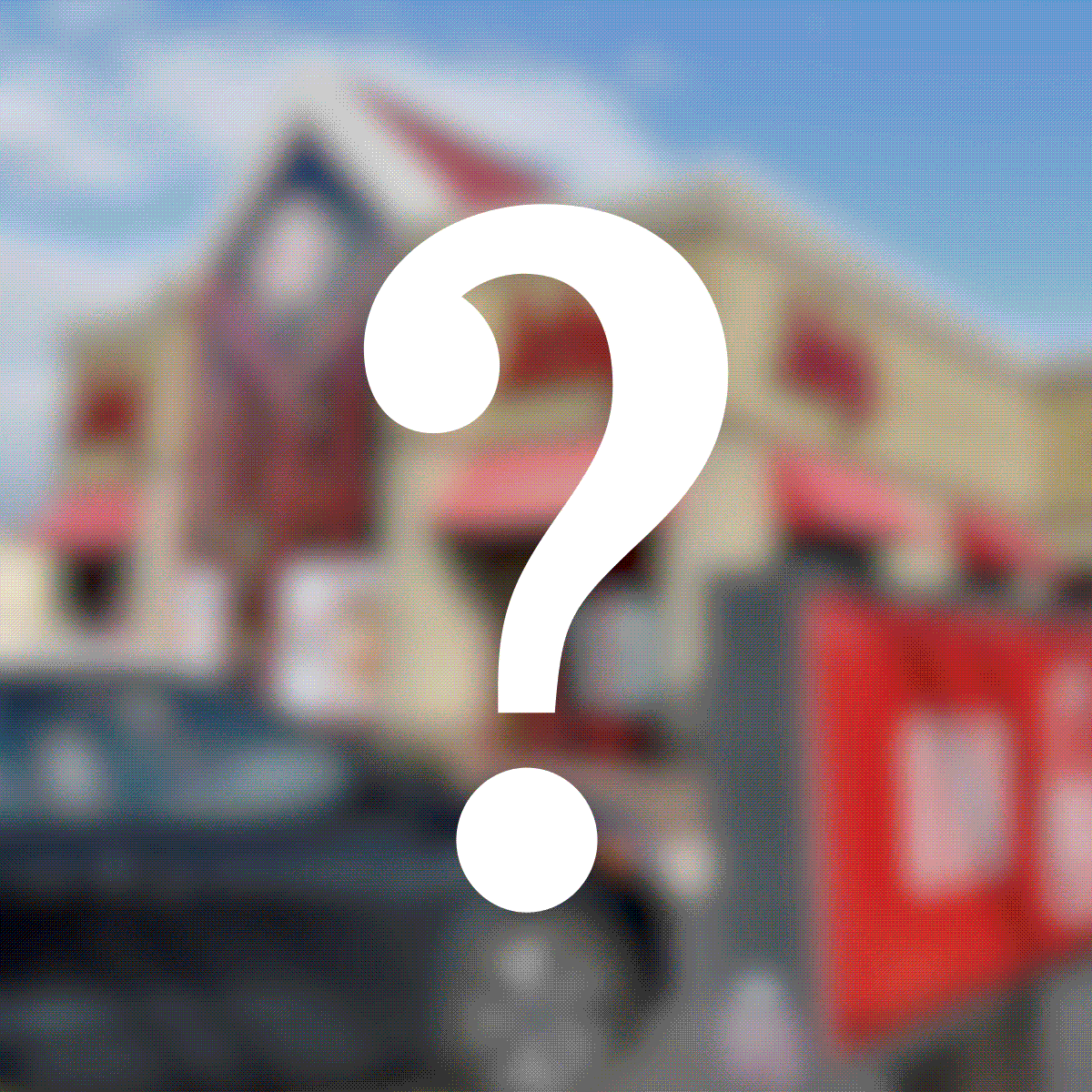 A large, white question mark overlays a blurred image of a building with red accents and a car outside under a blue sky.