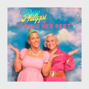 Two smiling individuals pose with arms raised, against a cloudy background. Text above them reads, 