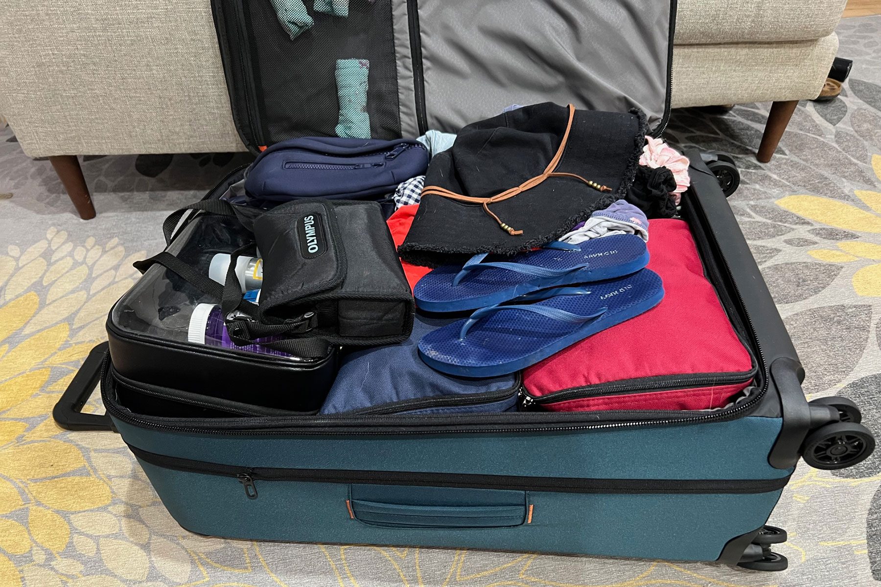 Briggs & Riley Zdx Luggage open and filled with Clothes and other luggage items