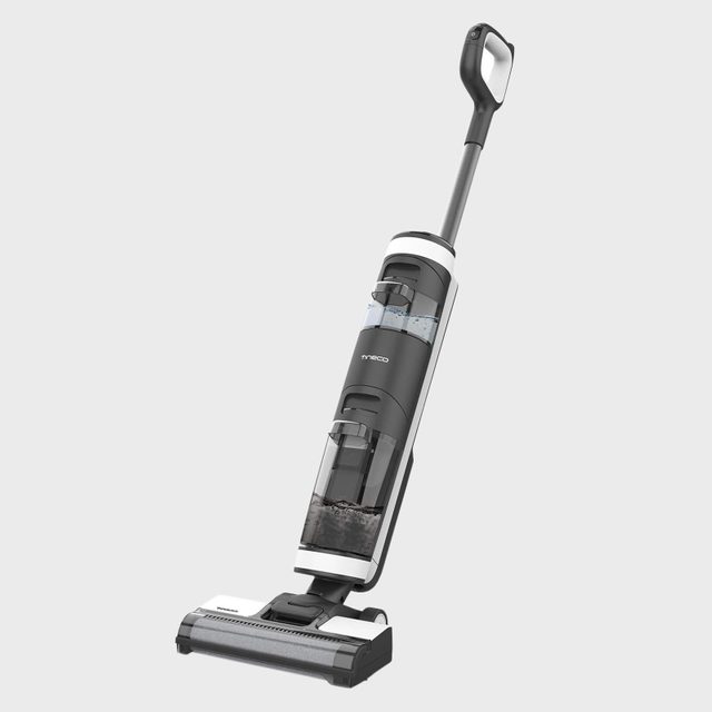 Vacuum cleaner stands upright, featuring a transparent water tank, on a plain light gray background.