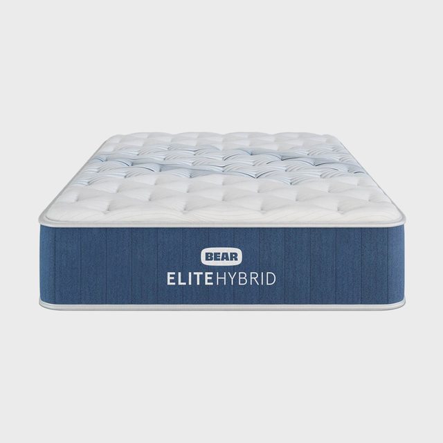 Mattress sits in a plain setting, displaying 
