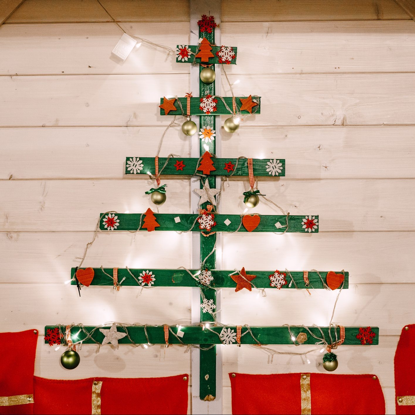 Abstract Christmas tree decorated with stars, hearts and snowflakes.