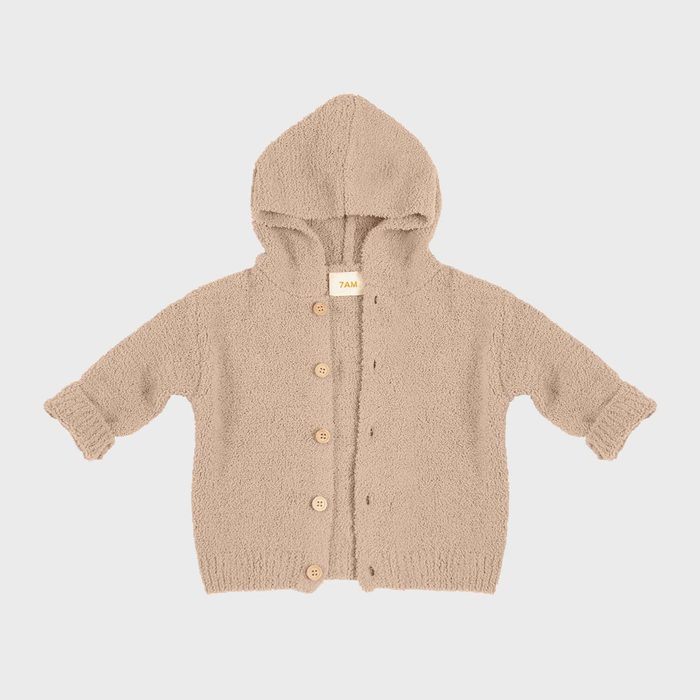 A beige hooded cardigan with buttons lies flat against a plain background. Label reads 