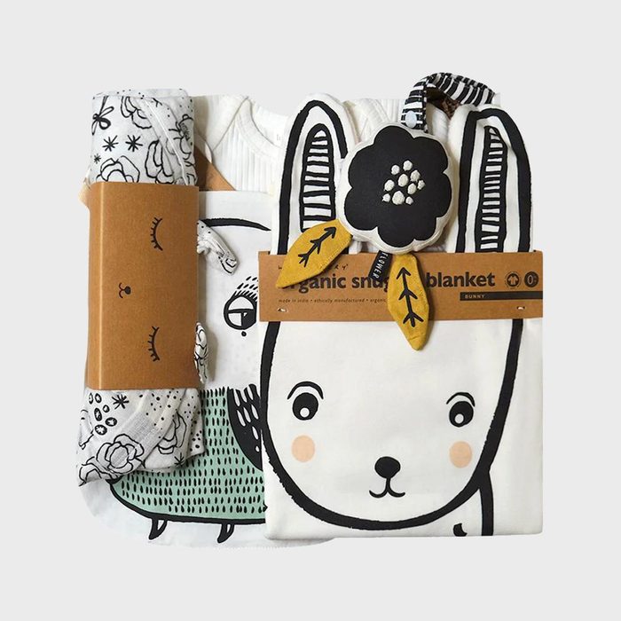 A children's bedding set features animal prints and illustrations, bundled with tags. The text reads 